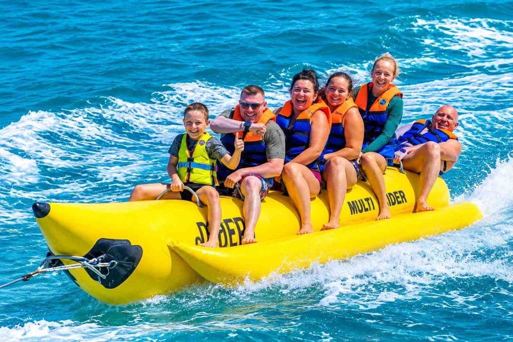 Banana Boat Ride in Andaman with an exciting group water sports experience on the clear blue sea.