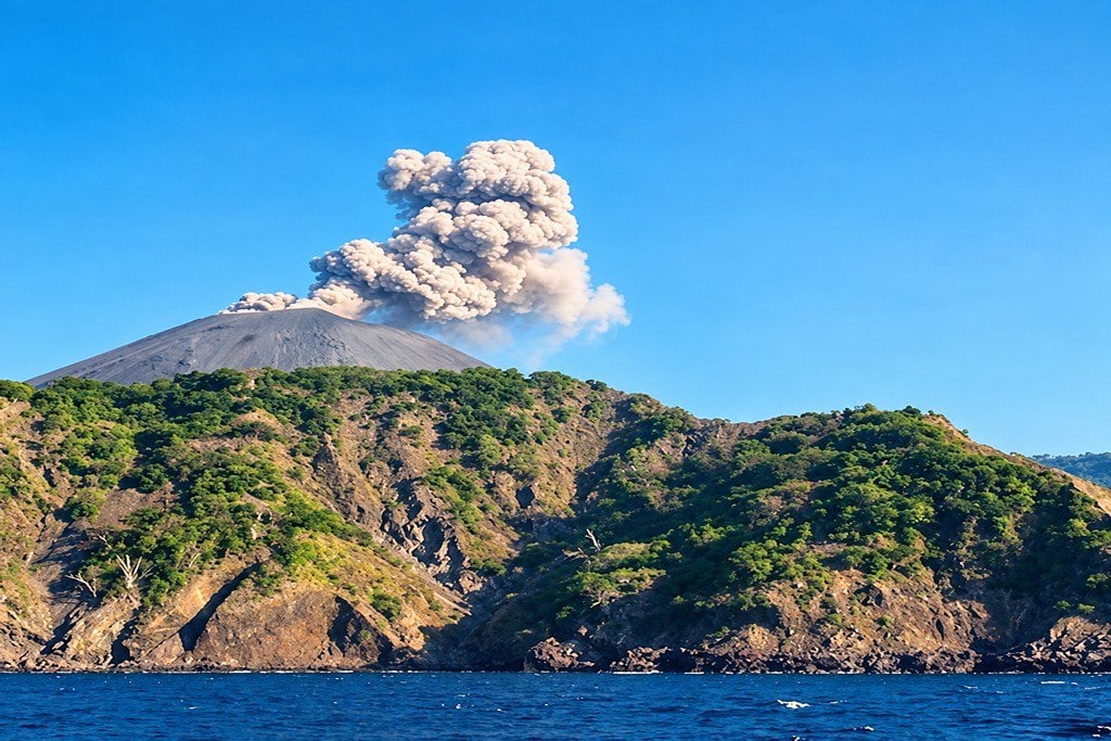 Rugged volcanic coastline of Barren Island surrounded by tropical sea in the Andaman region