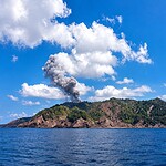 Rugged volcanic terrain of Barren Island surrounded by the Andaman Sea