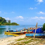 Jolly Buoy Island with clear blue water and coral reef surroundings in Andaman