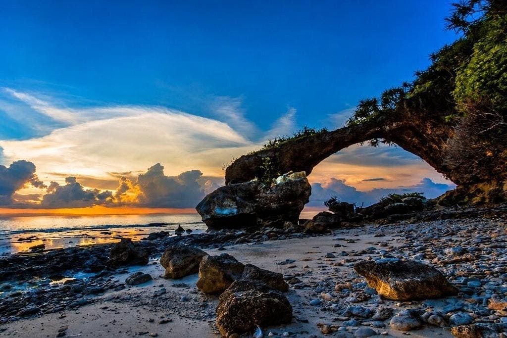Natural Rock Formation, popularly known as Howrah Bridge, at Neil Island, Andaman, with coastal rocks and clear sea views.