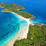 Scenic Cinque Island surrounded by clear blue sea and tropical coastal scenery in Andaman