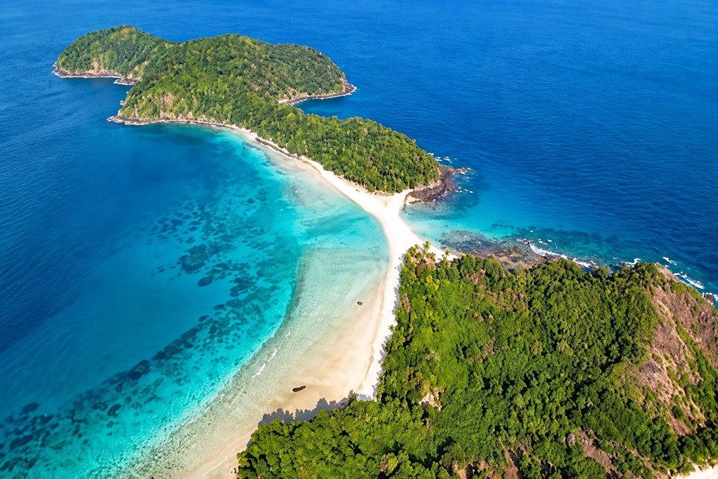 Scenic Cinque Island surrounded by clear blue sea and tropical coastal scenery in Andaman