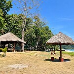 Quiet coastal setting of Ramnagar Beach near Diglipur surrounded by tropical greenery