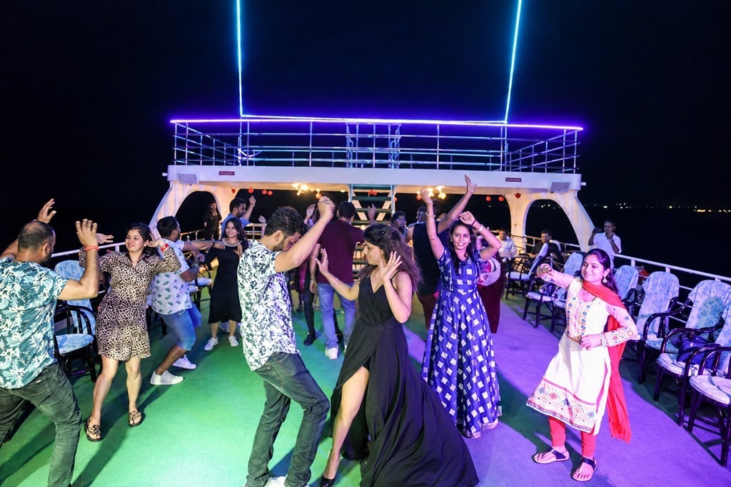 People enjoying live music during a luxury dinner cruise in Havelock Andaman