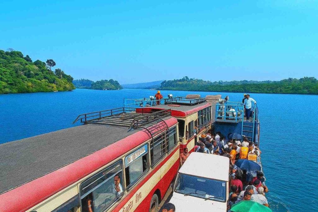 Boat ride on calm waters with tourists enjoying the scenic view.