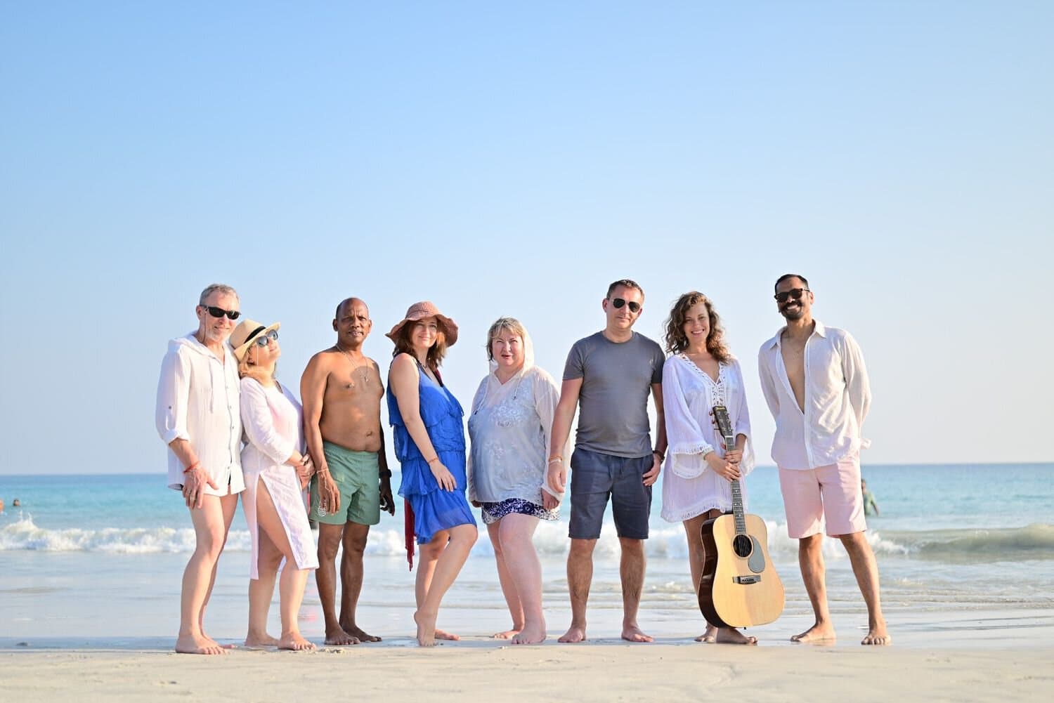 Group of diverse tourists enjoying a beach day in Andaman Islands.