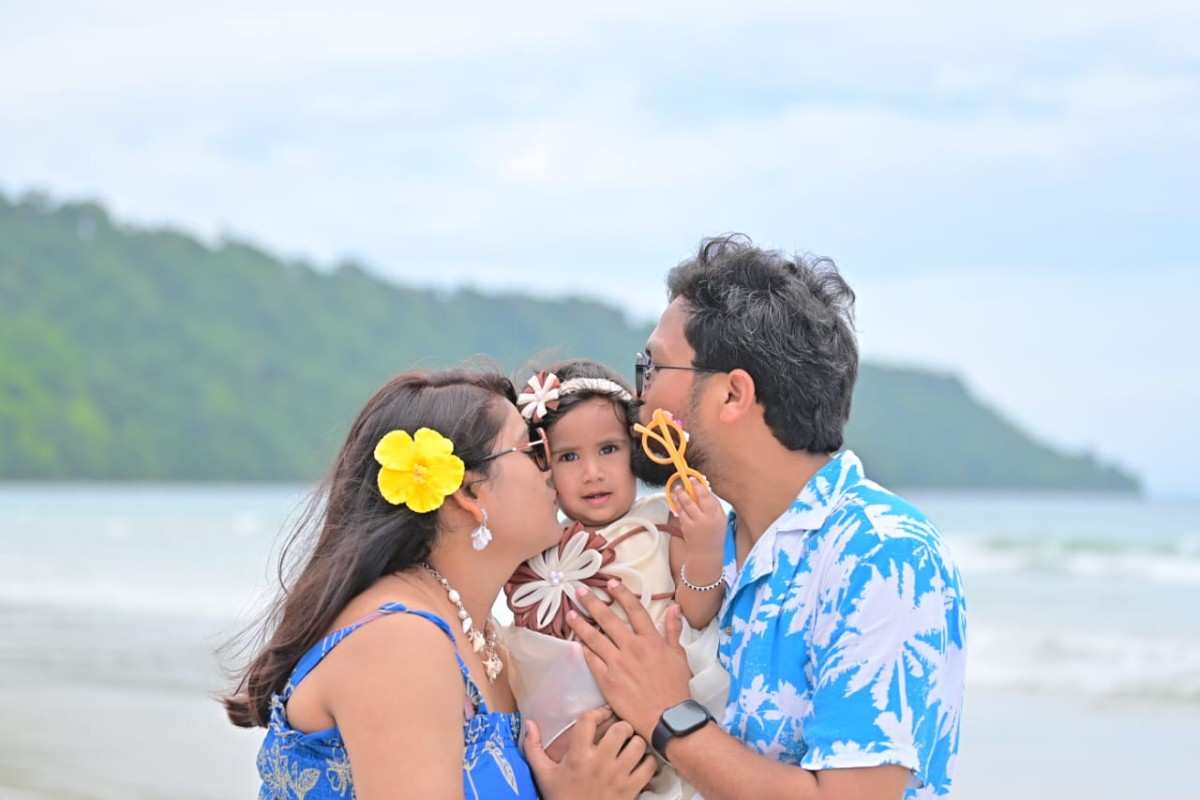 Family with child on the beach in Andaman during daytime.