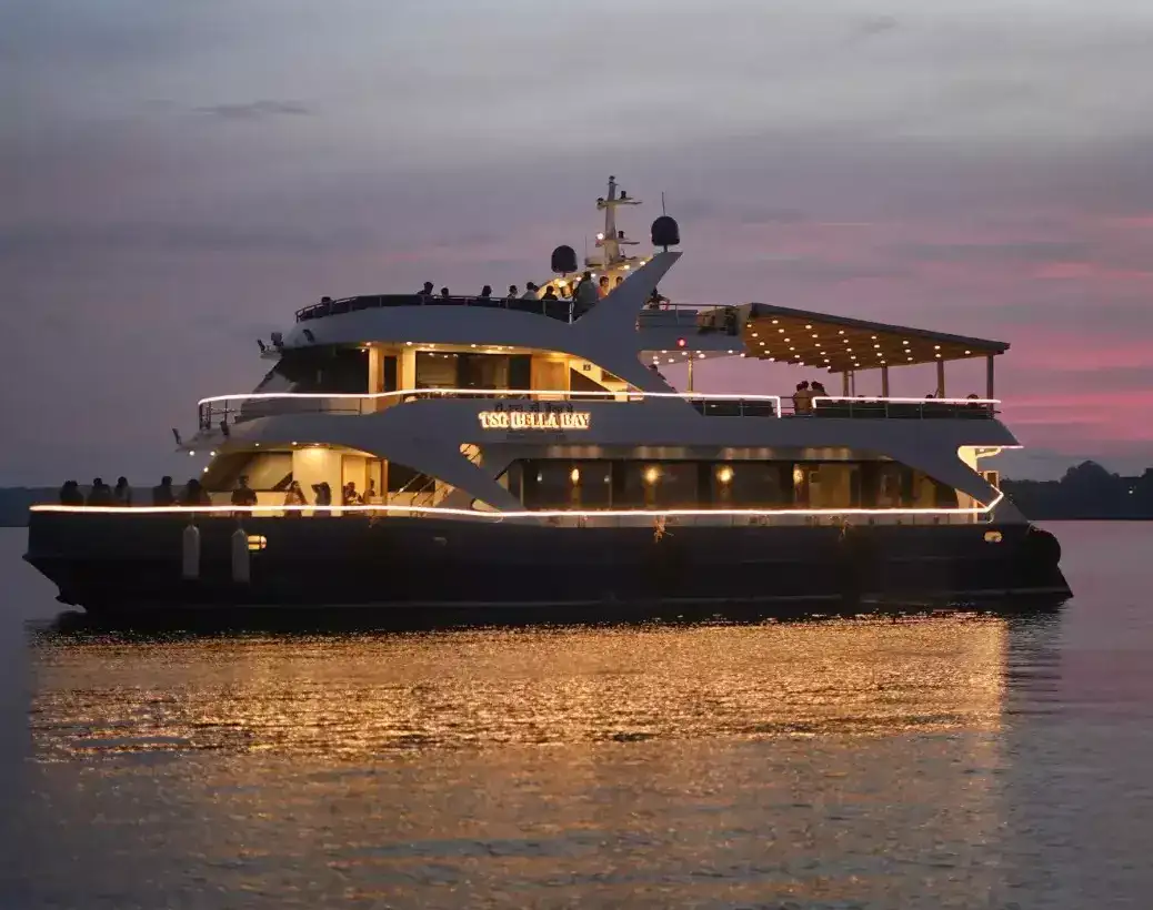 Family enjoying a luxury dinner cruise in the Andaman Islands with live music, delicious food, and beautiful sunset views over the sea.