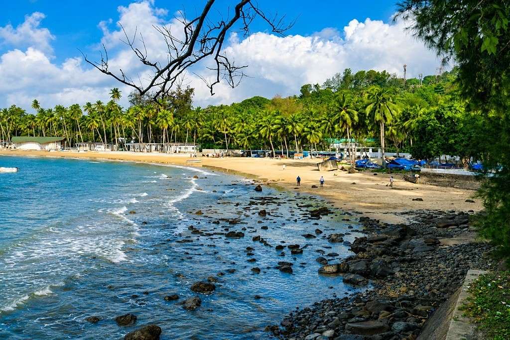Scenic Corbyn’s Cove Beach in Port Blair, Andaman Islands, with tropical shoreline and clear blue sea
