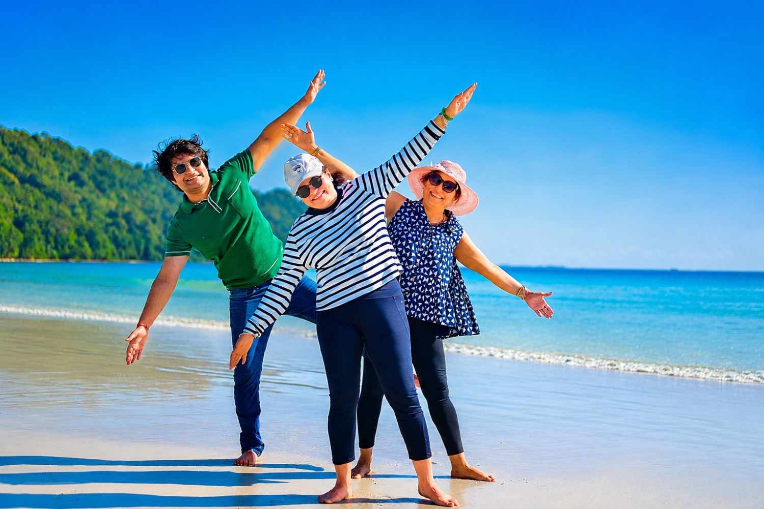 Happy family from Bangalore enjoying a relaxing and fun-filled beach vacation in the Andaman Islands with Andaman Ocean Tours & Travels.