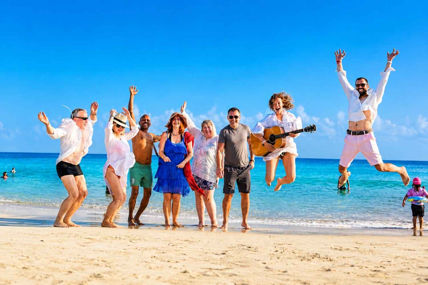 Happy foreign group tourists enjoying their Andaman holiday with Andaman Ocean Tours & Travels at a popular tourist destination in the Andaman Islands.