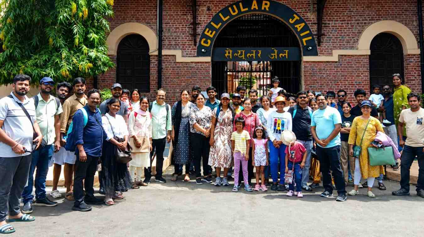 Happy guests posing for a group photo in front of Cellular Jail, Port Blair, during their memorable Andaman tour with Andaman Ocean Tours & Travels.