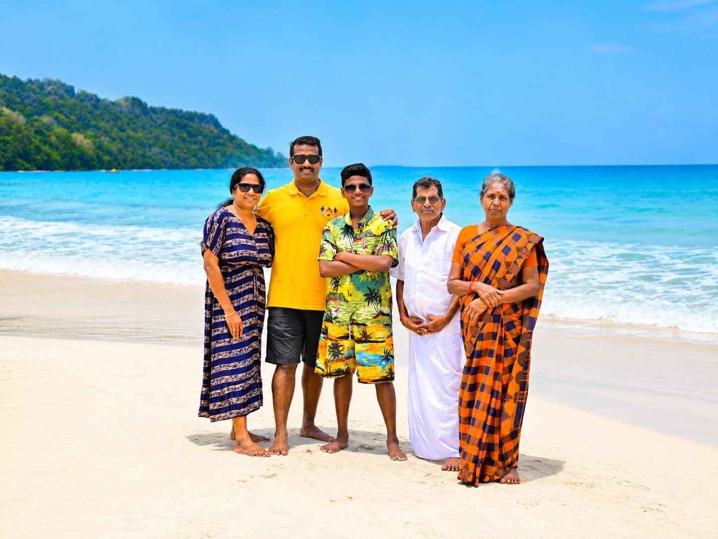 Happy family from Tamil Nadu enjoying their vacation at Radhanagar Beach, Havelock Island, during their Andaman family tour booked with Andaman Ocean Tours & Travels.