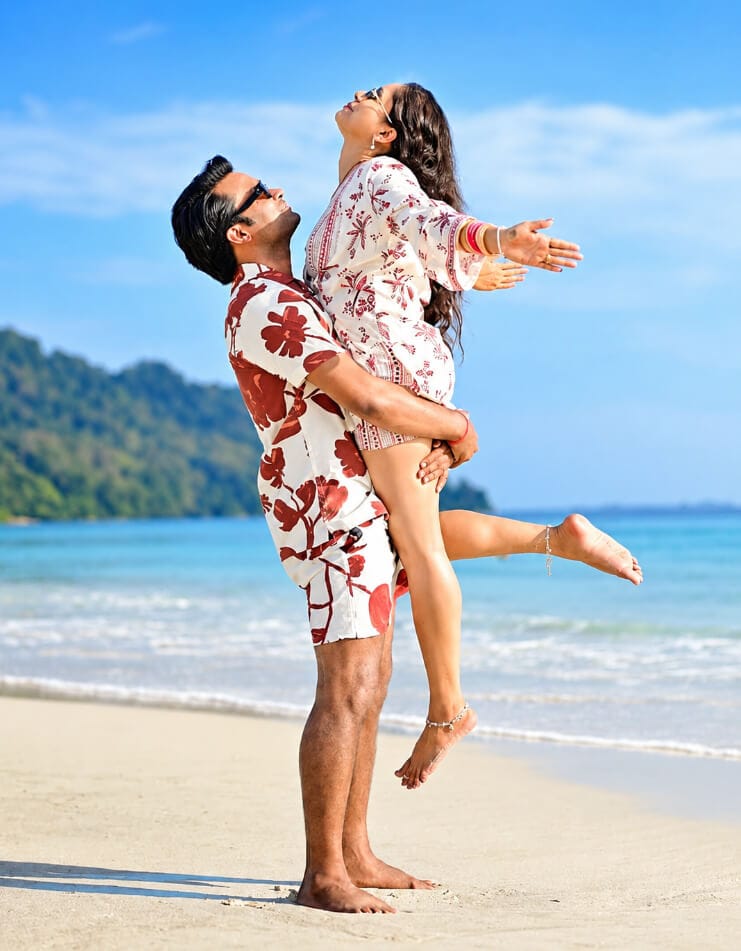 Couple having fun on the beach in Andaman with clear blue sky and ocean.