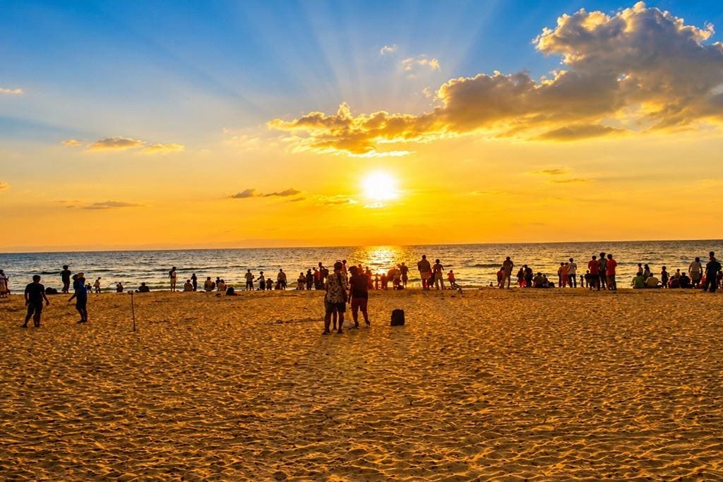 Sunset over Andaman Beach with people enjoying the view.