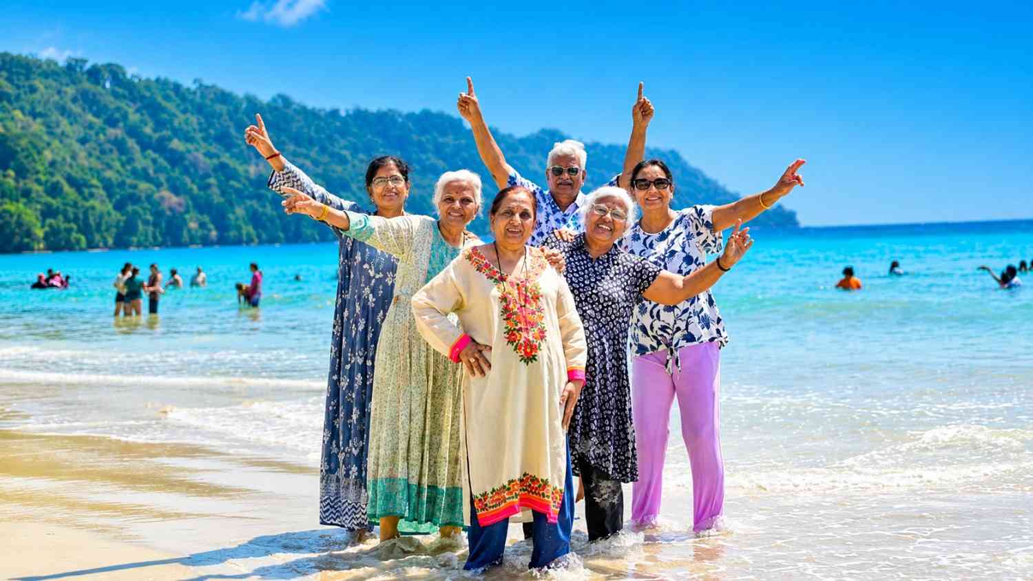 Happy senior citizens group after completing their Andaman tour with Andaman Ocean Tours & Travels at a popular tourist attraction in the Andaman Islands.