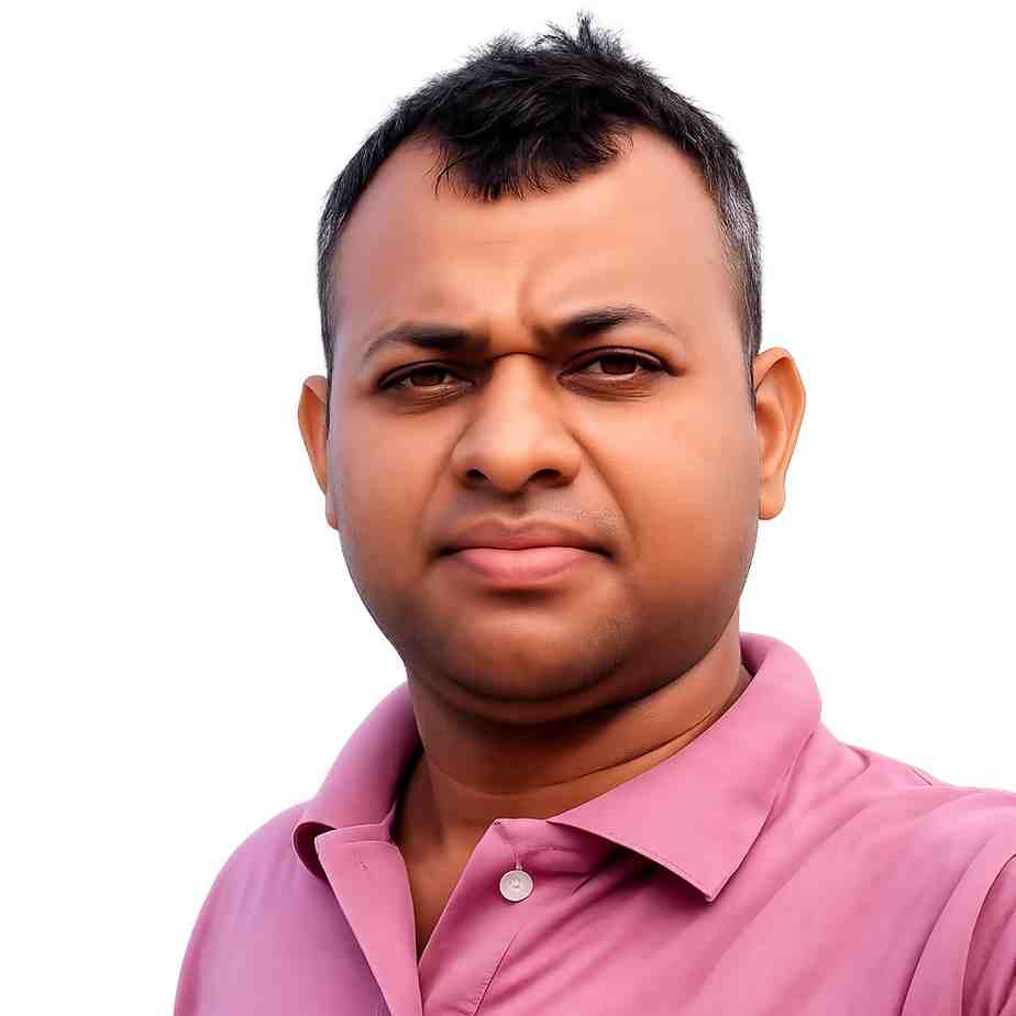 Portrait of a man in a pink shirt with a neutral background.