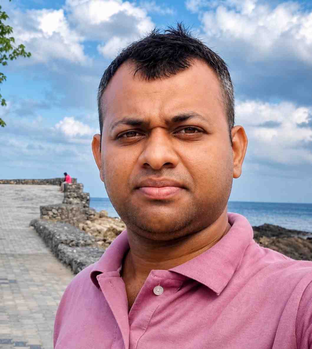 Man taking selfie at scenic coastal location in Andaman Islands.