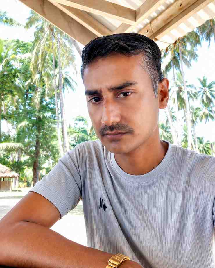 Man enjoying tropical scenery at Andaman Ocean Tours & Travels.