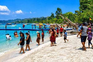 Tourists enjoying the beach and water activities in Andaman Islands.