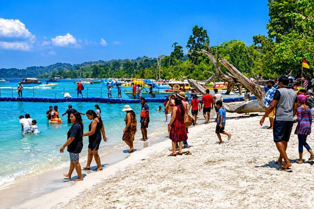Tourists enjoying the beach and water activities in Andaman Islands.